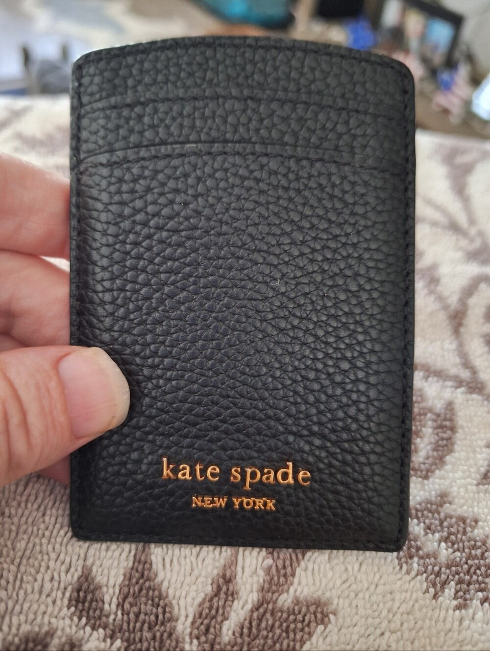 kate spade Black Pebbled Leather Card Sleeve with Gold Logo